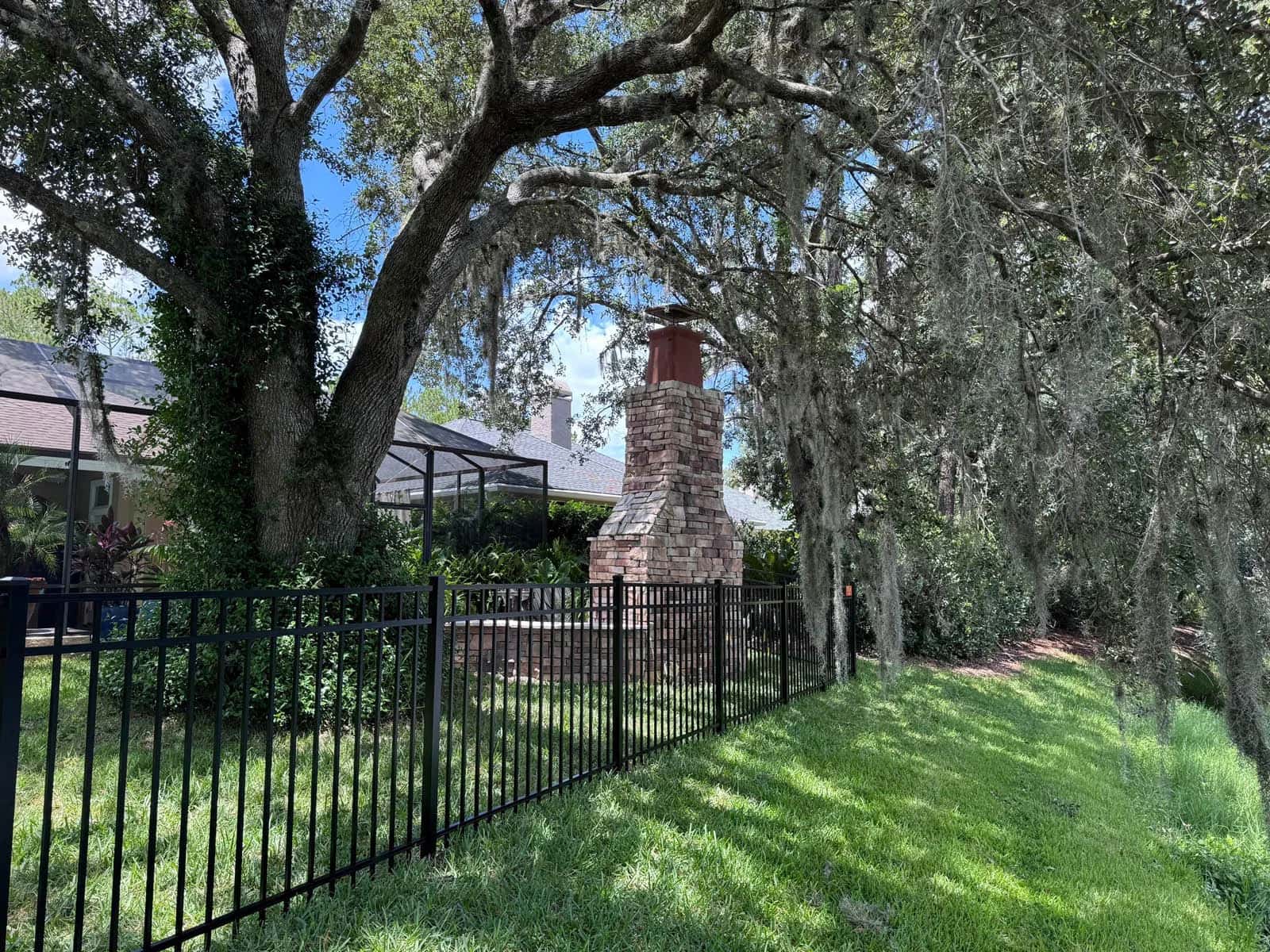 Florida 4 Foot 3 Rail Aluminum Fence Underneath Florida Tree With Spanish Moss
