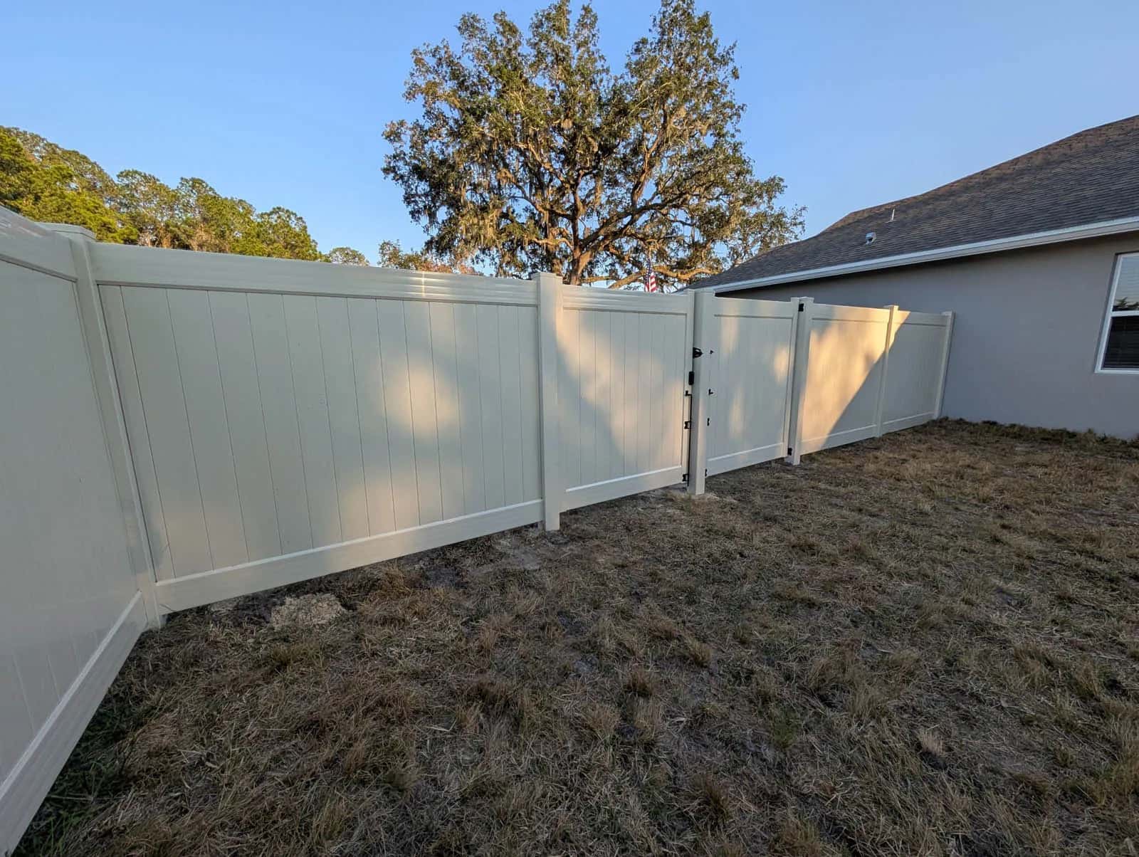 Florida Tan Six Foot Vinyl Privacy Fence With Double Drive Gate And Removable Gate Post