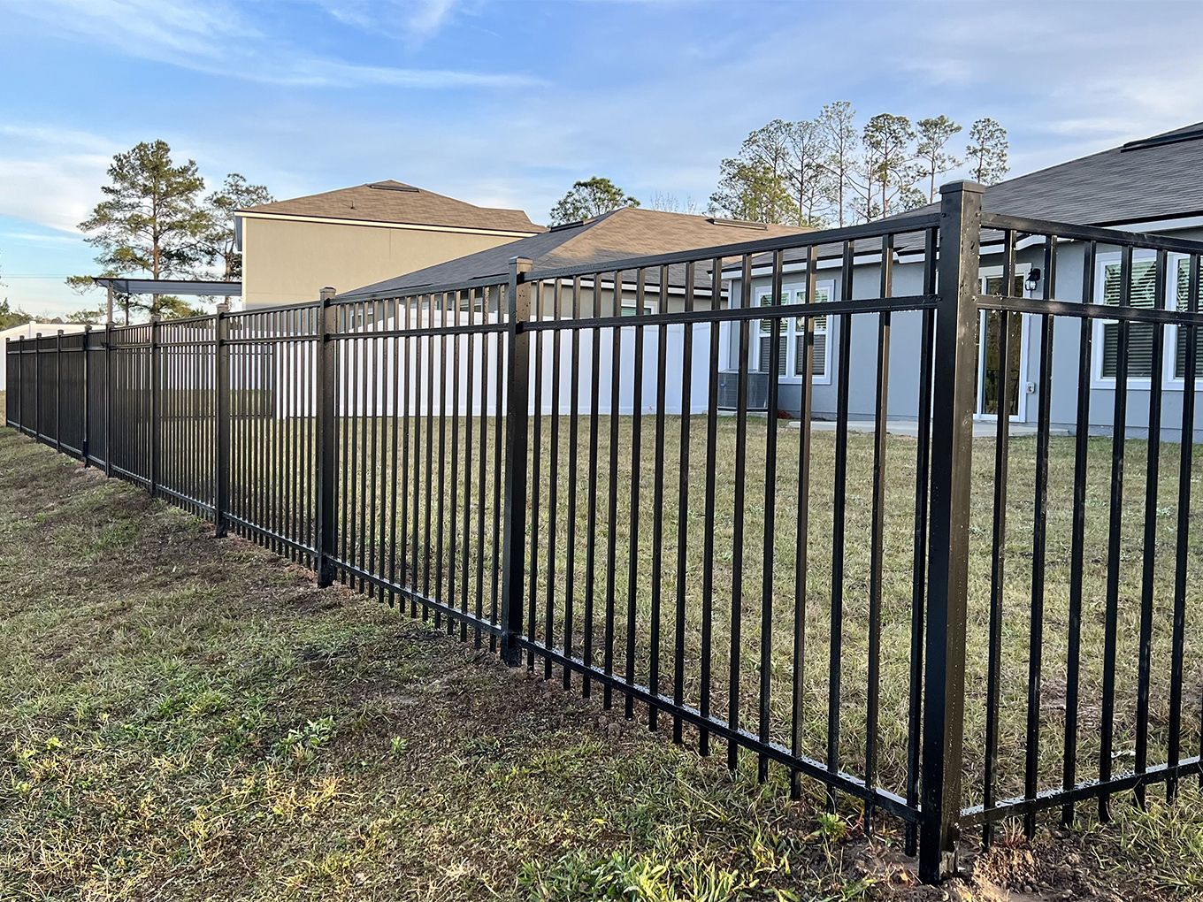 Aluminum fence in black at a residential yard in Florida