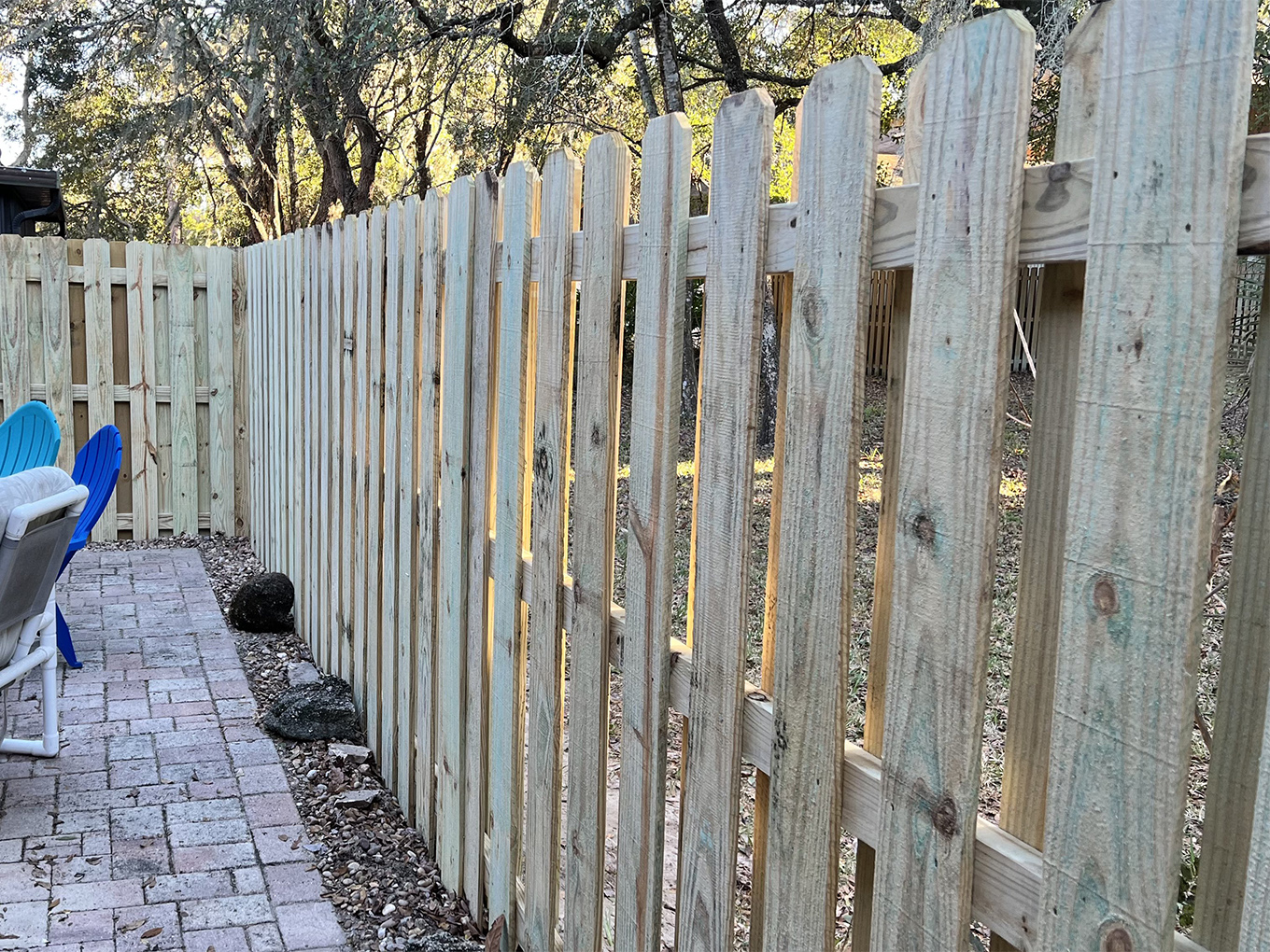 Photo of a newly installed wood shadowbox fence